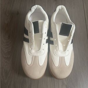 Chic White and Beige Sneakers with Black Accents